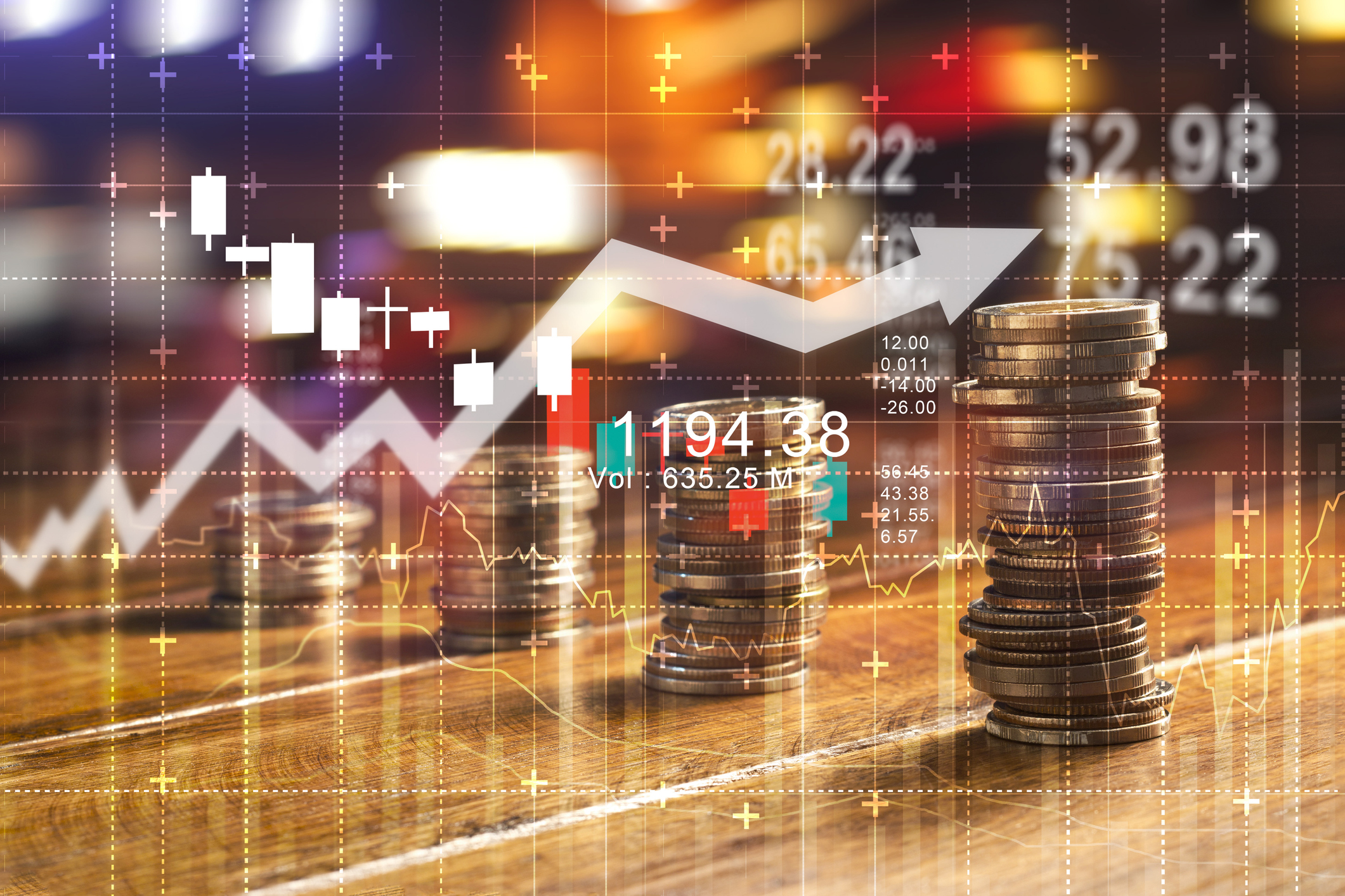 Finance and business concept. Investment graph and rows growth and of coins on table