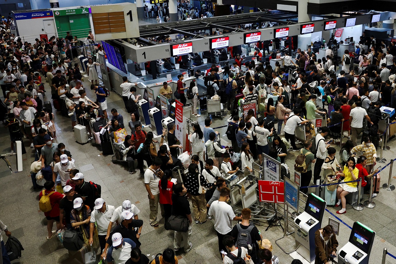 Terminal 1 do Aeroporto Internacional Don Mueang em Bangcoc durante apagão
 19/7/2024    REUTERS/Chalinee Thirasupa